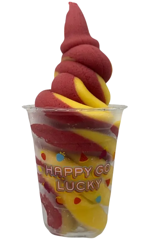 Red and yellow swirled soft-serve ice cream in a clear cup with Happy Go Lucky branding and sprinkles, a colorful frozen treat momentined in a cup.